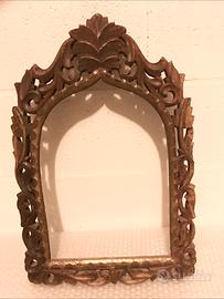 Cornice in legno scolpita