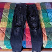 jeans amiri con logo gigante 