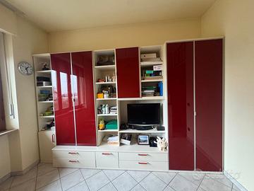 Soggiorno - Camera - Studio. parete attrezzata