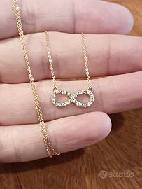 Collana in oro giallo 9kt con simbolo del infinito