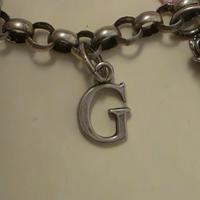 charm G raspini 