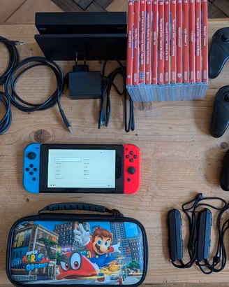 Console Nintendo Switch con 13 giochi e accessori.