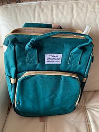 Zaino fasciatoio verde con lettino pieghevole