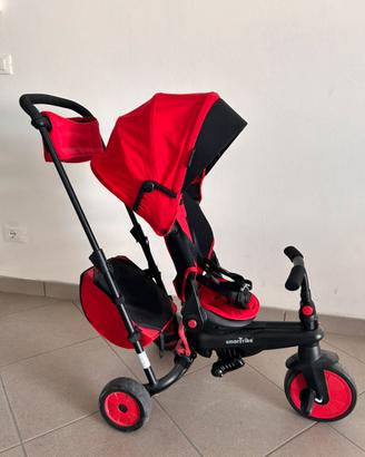 Triciclo passegino