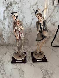 Due statuine G. Armani