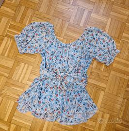 Blusa con stampa floreale e fiocco sulla schiena