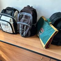 3 Zaini + 1 cartella porta documenti.