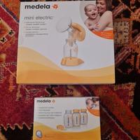 Medela mini electric e bottigliette latte materno
