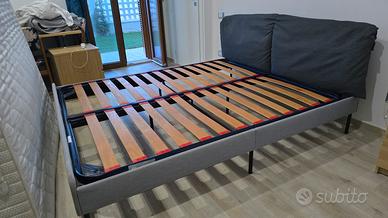 rete matrimoniale con bordo e testata imbottita