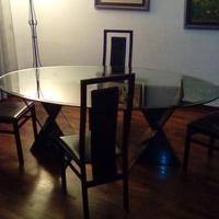 Tavolo in cristallo con piedi in marmo africano e