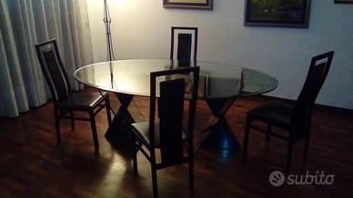 Tavolo in cristallo con piedi in marmo africano e