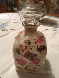 Bottiglia rivestita in decupag