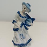 statuetta signora con arpa