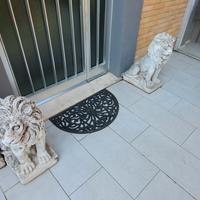 Coppia leoni cemento