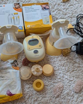 Medela tiralatte con accessori 