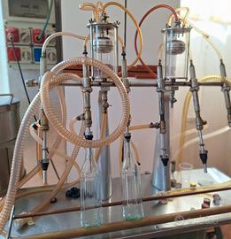 Riempitrice bottiglie liquori vino olio birra