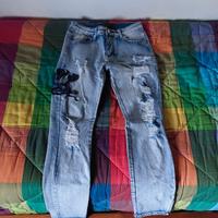 jeans amiri con logo serpente