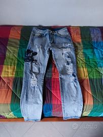 jeans amiri con logo serpente