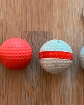 4 Palline da golf. 1 è un portachiavi