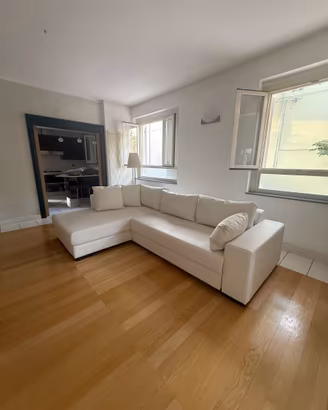Divano Letto a L ecopelle bianco