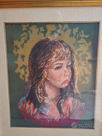 raffigurazione di viso di bambina punto e croce