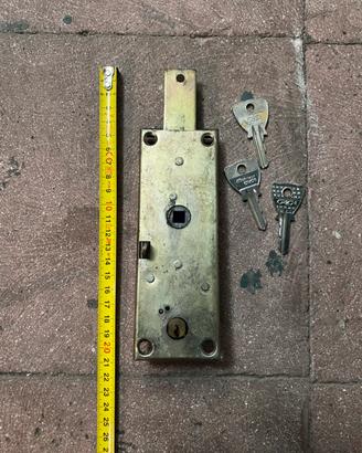 Serratura porta basculante