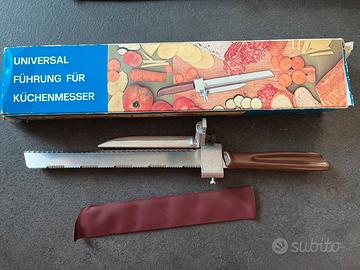 Coltello con distanziale per affettare manualmente