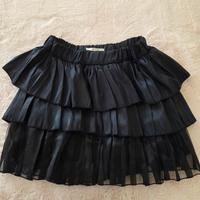 Gonna mini a balze nera lucida