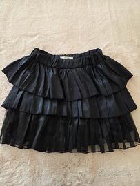 Gonna mini a balze nera lucida