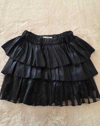 Gonna mini a balze nera lucida