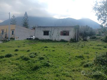 Terreno con casa