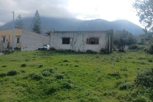 Terreno con casa
