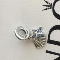 Pandora Charm stella marina tropicale e conchiglia