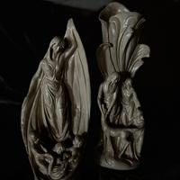 Coppia di sculture decorative in ceramica