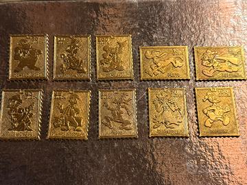 Lotto 10 francobolli metallici dorati Disney