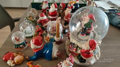 collezione di 19 Babbo Natale in ceramica e altri 