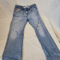 Jeans Diesel regular fit usati con strappi Burri