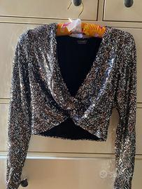 Top a maniche lunghe con paillettes