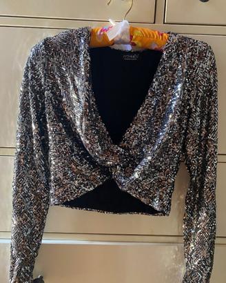 Top a maniche lunghe con paillettes