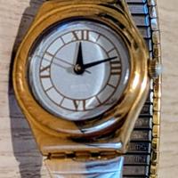 Swatch Irony con cinturino elastico dorato