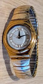 Swatch Irony con cinturino elastico dorato