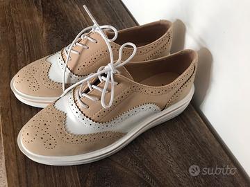 Scarpe bianche e beige a nido di rondine