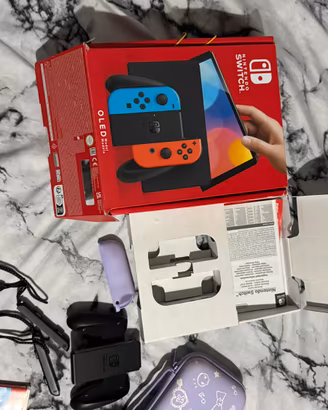 Nintendo Switch OLED Blu/Rossa + Animal Crossing