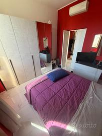 camera da letto + divano