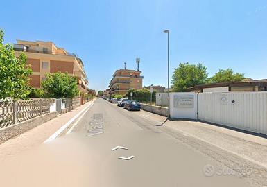 Fiumicino trilocale con giardino e p.auto