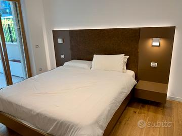 Letto matrimoniale pelle primo fiore e laccato