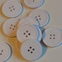 Bottoni Givenchy in ceramica profumata