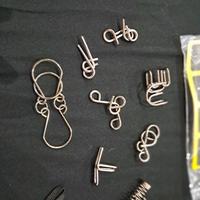 8 Pezzi Gioco di Puzzle Test di Logica ia acciaio 