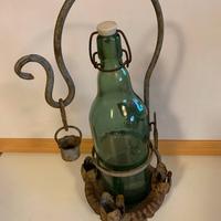 Antico porta bottiglia in ferro