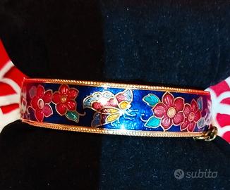 Bracciale rigido in metallo dorato e smalti 